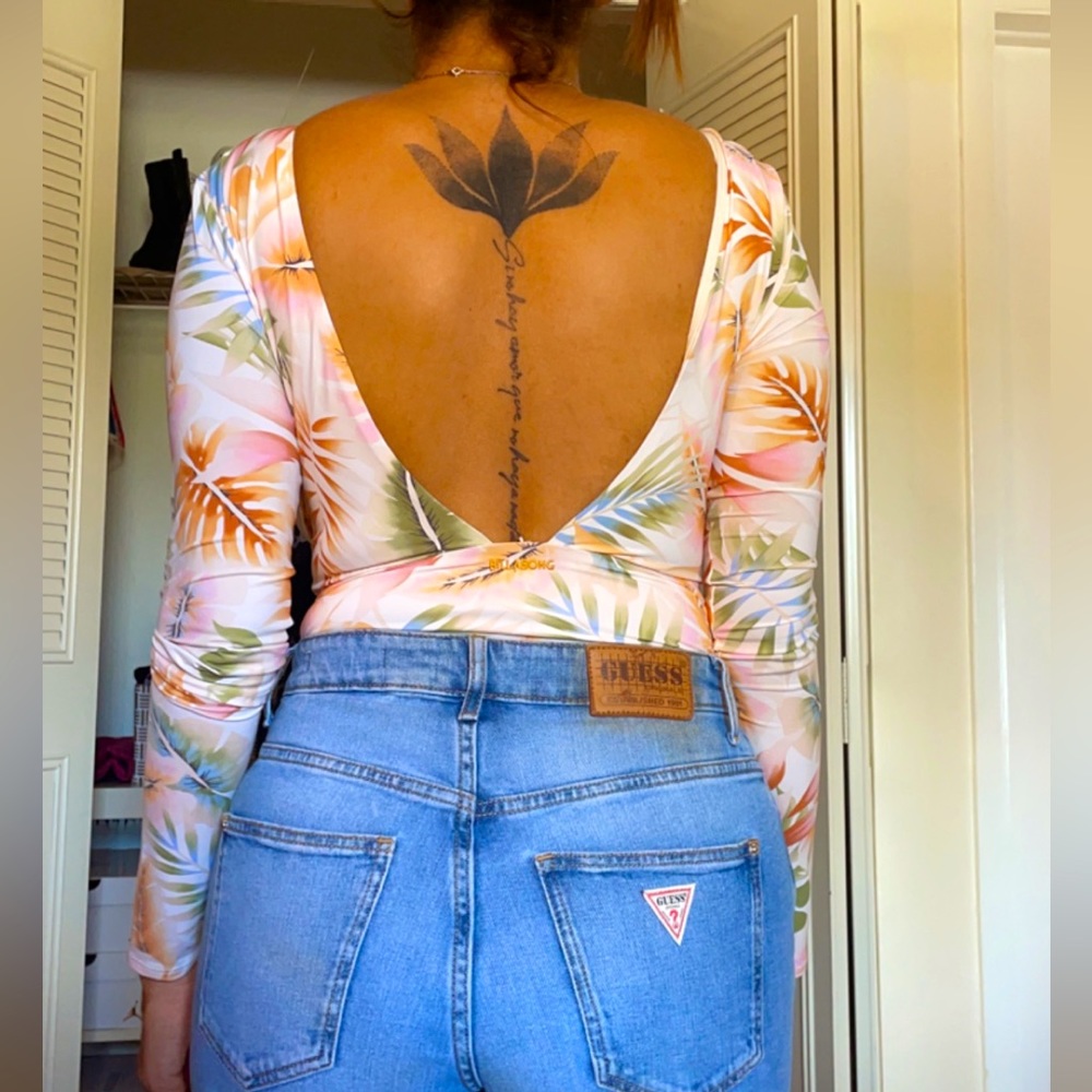 Billabong Long sleeve body white with flowers. Size S